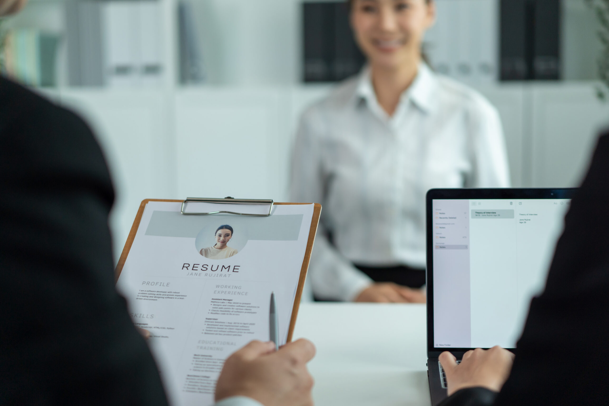 A direct sales job applicant in an interview with hiring managers.